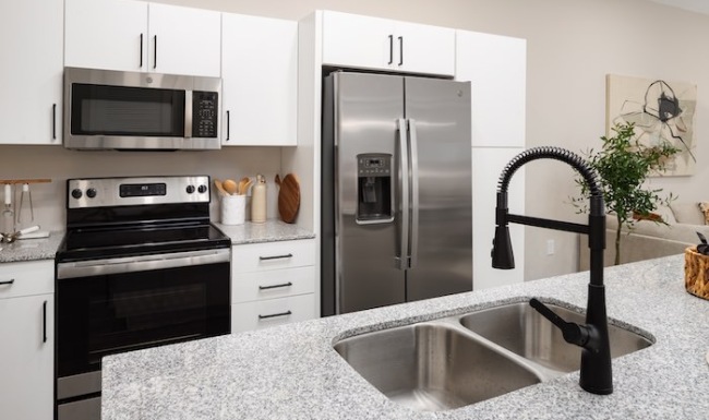Model Apartment Home Stainless steel appliances in a kitchen at The Crossings apartments in Antioch Nashville.